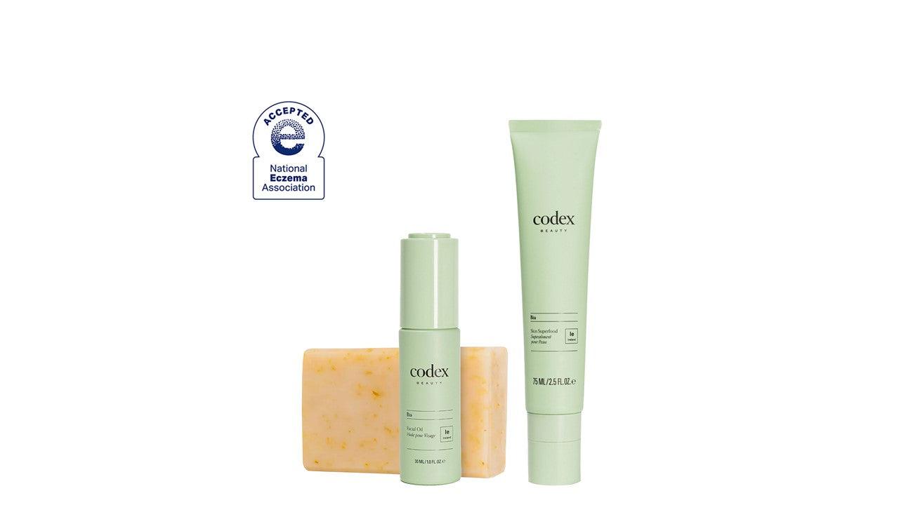 A bottle of Bia Skin Superfood and Bia Nourishing Facial Oil next to a Bia Unscented bar of soap